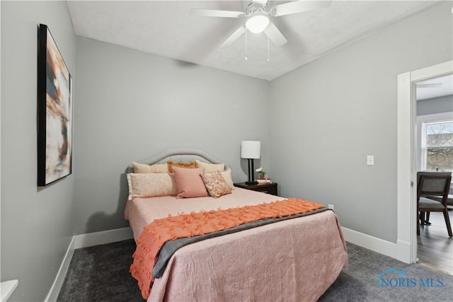 bedroom featuring carpet, baseboards, and a ceiling fan