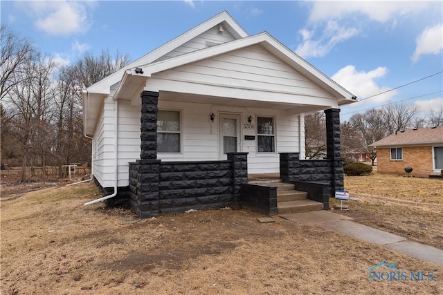 bungalow-style house featuring covered porch