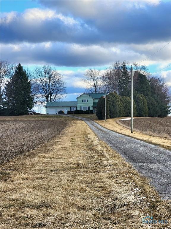 view of road featuring aphalt driveway