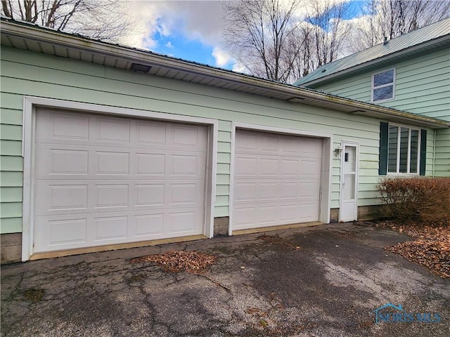 garage featuring driveway