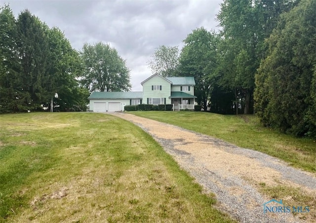 3221 Carrell Rd, Bucyrus, OH 44820 - traditional-style house with driveway, a front lawn, and an attached garage