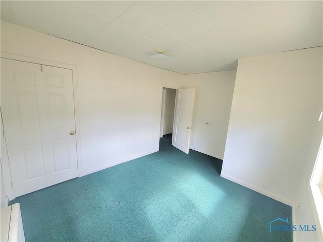 unfurnished bedroom featuring baseboards