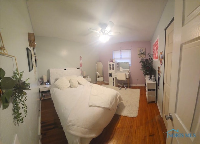 bedroom with wood finished floors and a ceiling fan