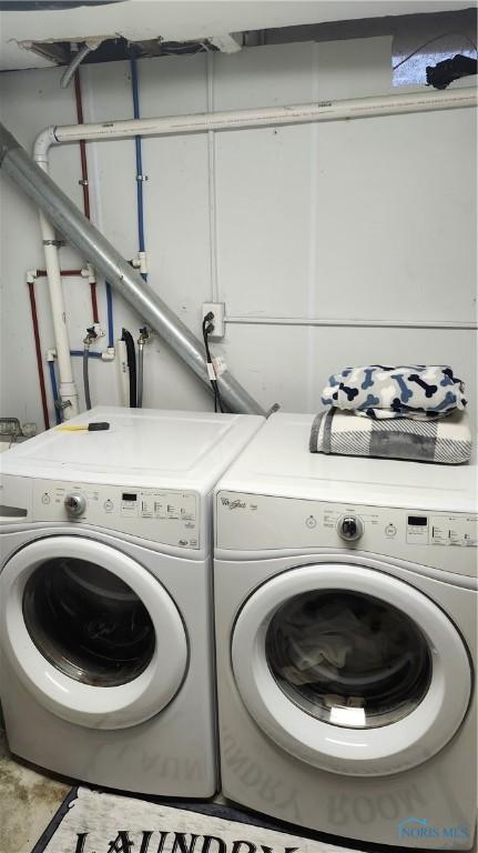 washroom featuring laundry area and washer and clothes dryer