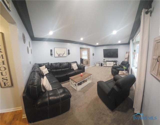 living room with recessed lighting and baseboards