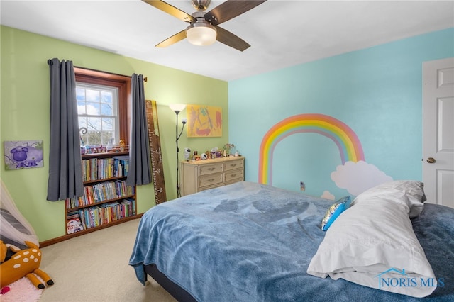 bedroom featuring a ceiling fan, baseboards, and carpet flooring