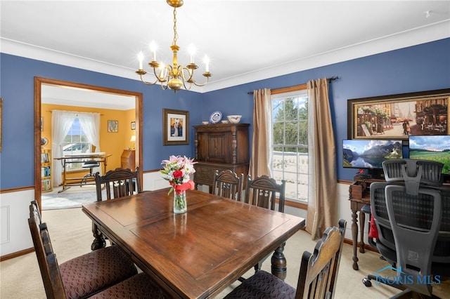 dining area with light colored carpet and a notable chandelier