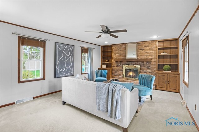 5605 Weckerly Rd, Whitehouse, OH 43571 - carpeted living room with visible vents, ornamental molding, baseboards, and ceiling fan