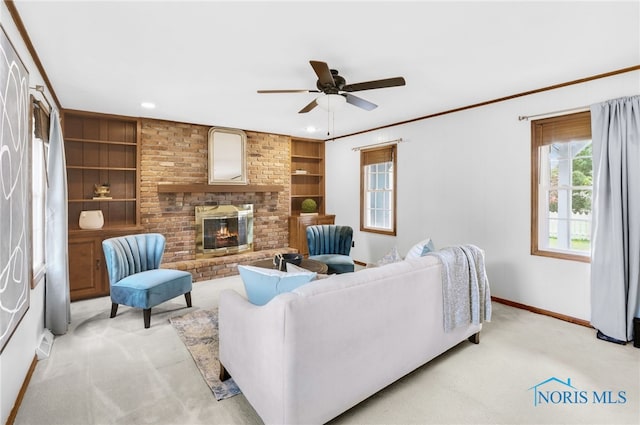 5605 Weckerly Rd, Whitehouse, OH 43571 - living room with a ceiling fan, built in features, a fireplace, baseboards, and light carpet