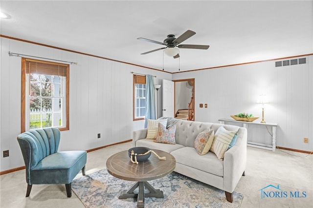 5605 Weckerly Rd, Whitehouse, OH 43571 - carpeted living room featuring ceiling fan, visible vents, crown molding, baseboards, and stairs