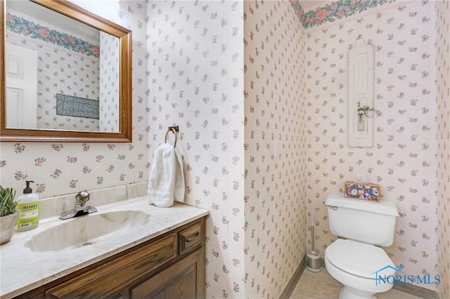 5605 Weckerly Rd, Whitehouse, OH 43571 - bathroom with tile patterned flooring, vanity, baseboards, toilet, and wallpapered walls