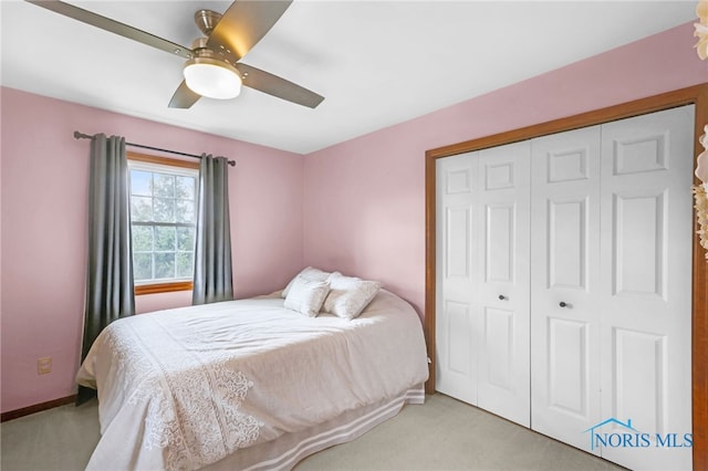 5605 Weckerly Rd, Whitehouse, OH 43571 - bedroom featuring a closet, a ceiling fan, and light colored carpet