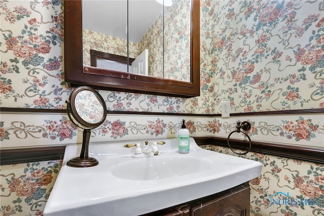 5605 Weckerly Rd, Whitehouse, OH 43571 - details with vanity and wallpapered walls