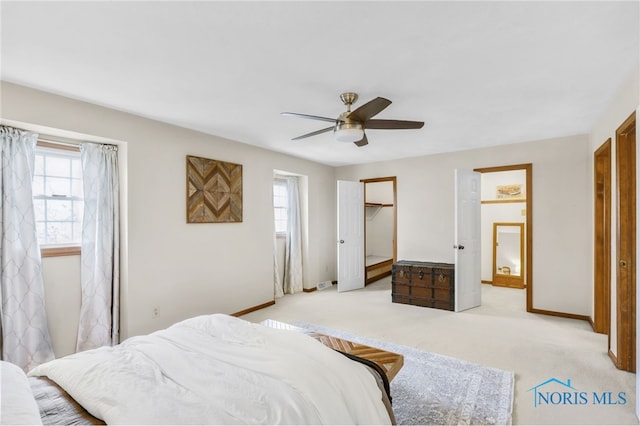 5605 Weckerly Rd, Whitehouse, OH 43571 - bedroom featuring a ceiling fan, light colored carpet, baseboards, a closet, and a spacious closet