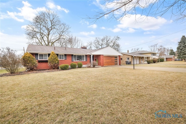 ranch-style house featuring a garage, driveway, a chimney, a front yard, and brick siding