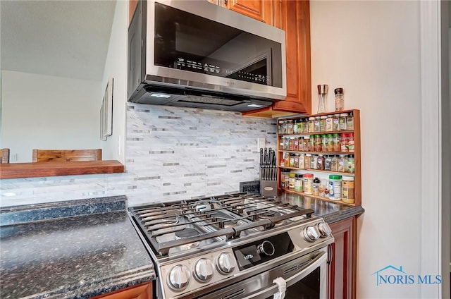 kitchen with stainless steel appliances, brown cabinets, and decorative backsplash