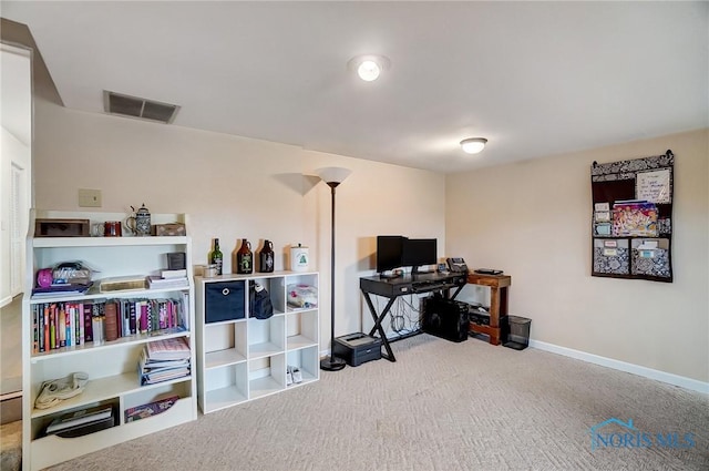 office space with carpet floors, visible vents, and baseboards