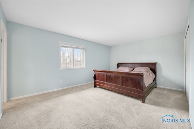 carpeted bedroom with baseboards