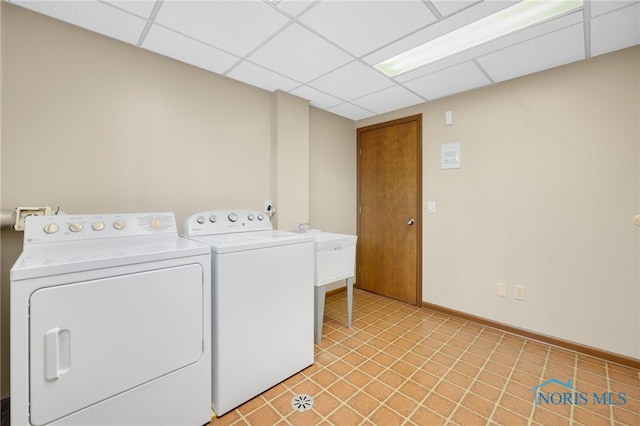 laundry area featuring laundry area, independent washer and dryer, and baseboards