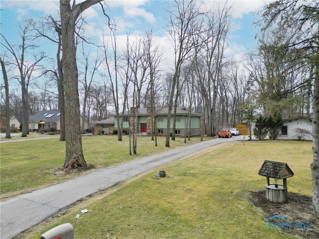 exterior space with a front lawn