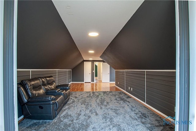 additional living space with lofted ceiling and carpet floors