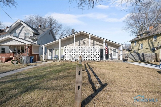 view of front of property with a porch and a front yard