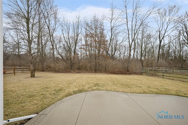 view of yard featuring a patio area and fence