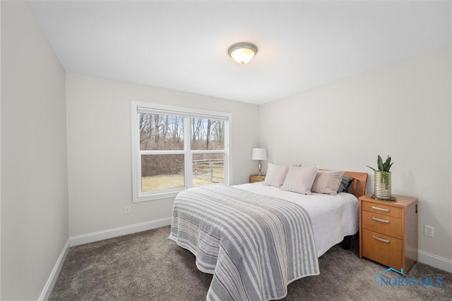 carpeted bedroom featuring baseboards