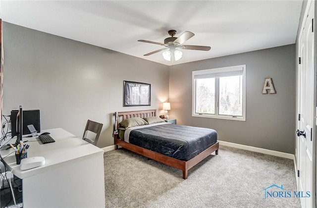 bedroom with a ceiling fan, carpet flooring, and baseboards