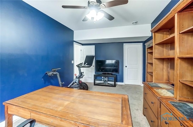 office area featuring ceiling fan and baseboards