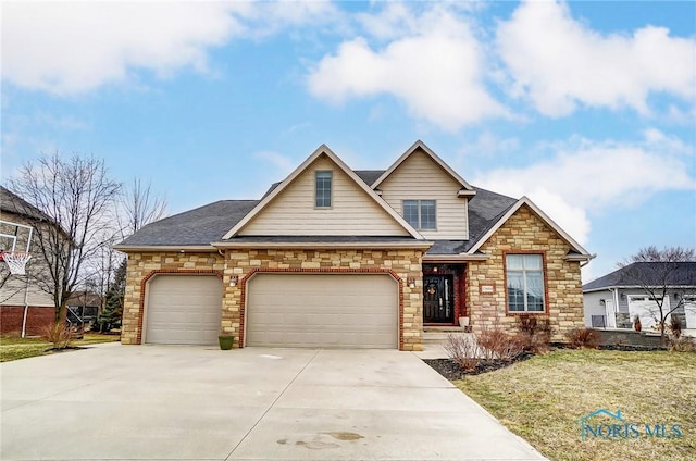 traditional home with driveway, an attached garage, and roof with shingles