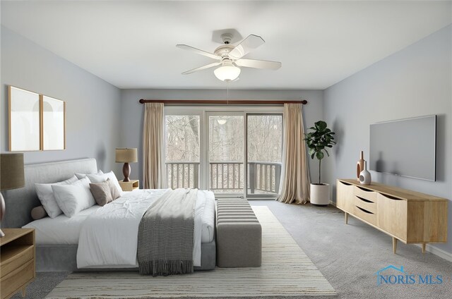 bedroom with carpet floors, access to outside, and a ceiling fan