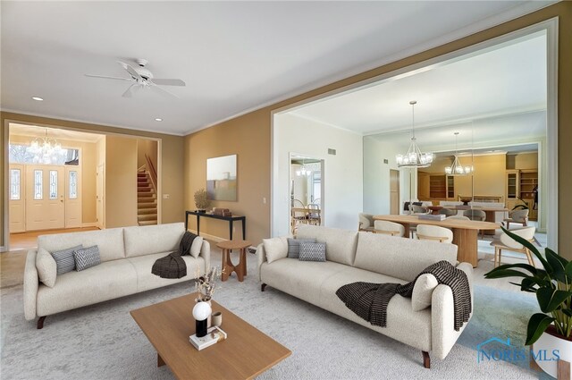 living room featuring carpet, recessed lighting, crown molding, and ceiling fan with notable chandelier