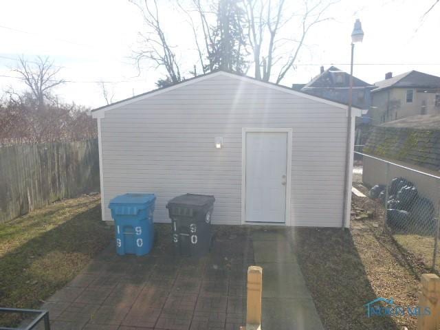 view of outbuilding featuring an outdoor structure and a fenced backyard