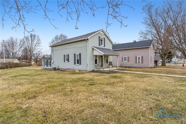 view of front facade with central AC and a front lawn