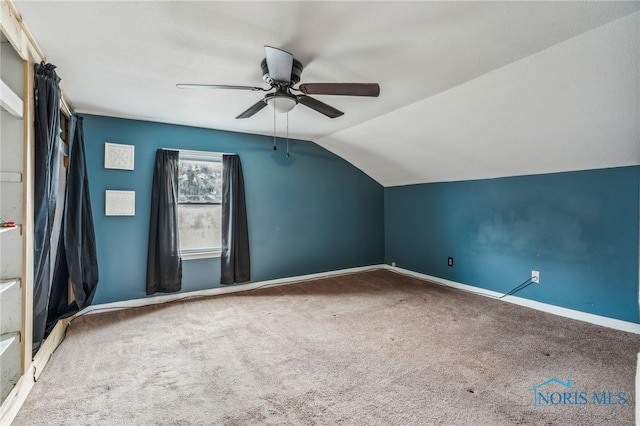 bonus room featuring baseboards, carpet floors, ceiling fan, and vaulted ceiling