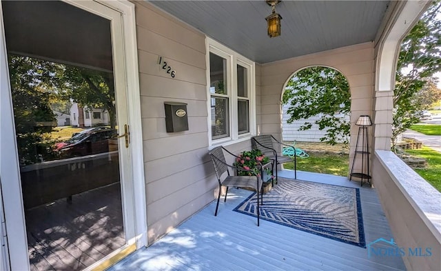 wooden terrace featuring a porch