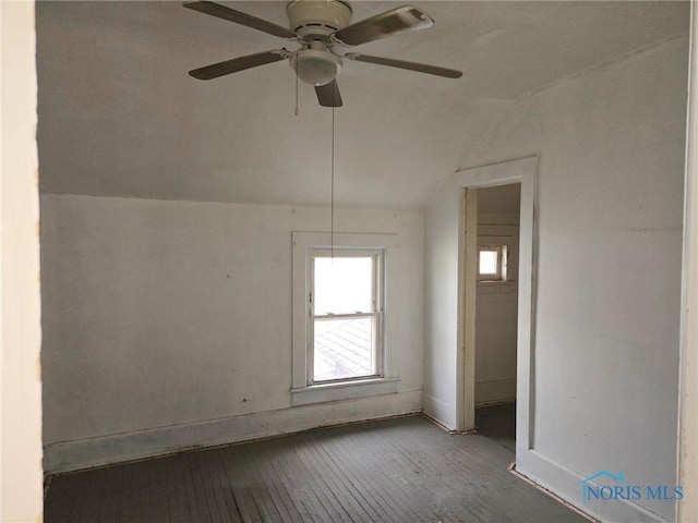 empty room with lofted ceiling and hardwood / wood-style floors