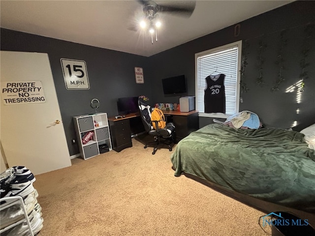 carpeted bedroom with a ceiling fan