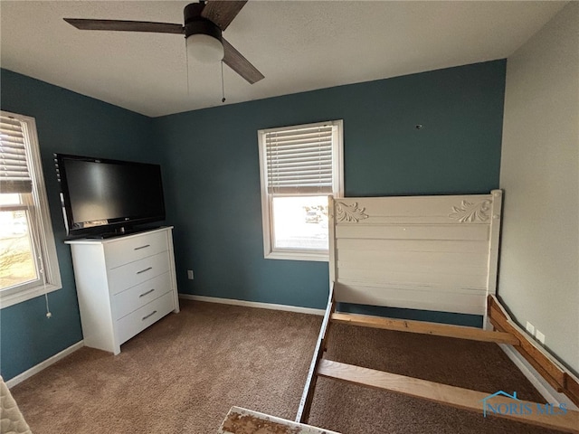 unfurnished bedroom with carpet flooring, ceiling fan, and baseboards