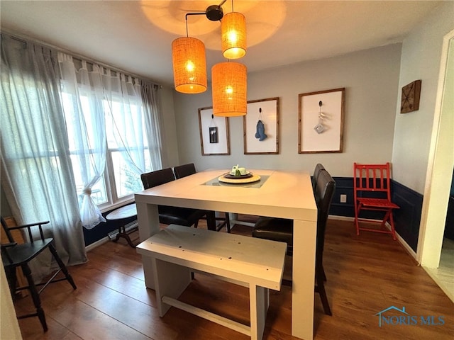 dining room with wood finished floors