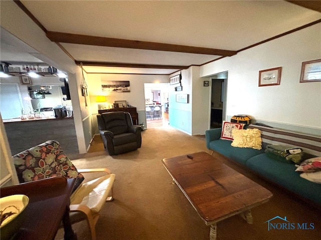 carpeted living area featuring beam ceiling and crown molding