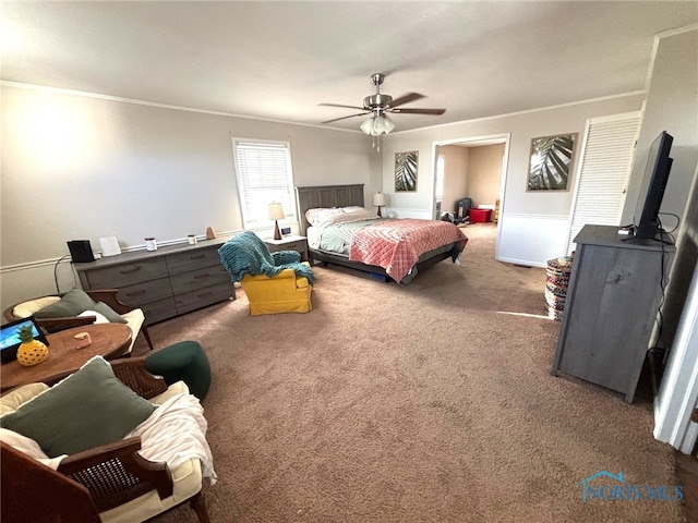 bedroom featuring ceiling fan, carpet, and ornamental molding