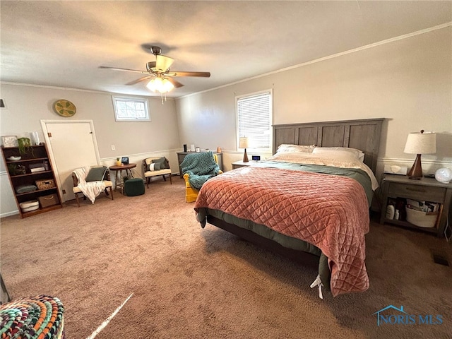 bedroom featuring carpet flooring, crown molding, and ceiling fan