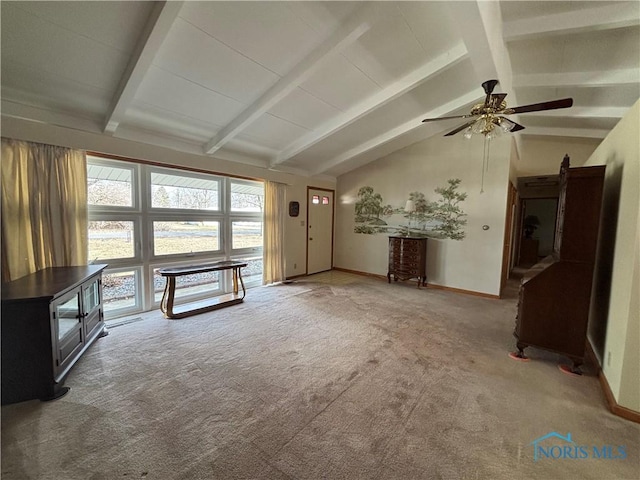 unfurnished living room featuring carpet floors, vaulted ceiling with beams, baseboards, and a ceiling fan