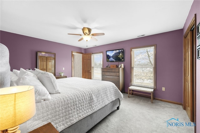 bedroom featuring carpet, visible vents, ceiling fan, and baseboards