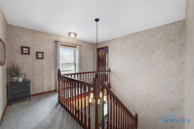 stairway with carpet floors and baseboards