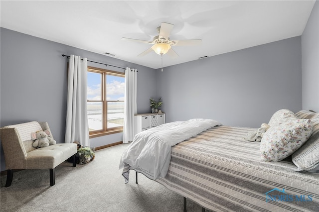 bedroom featuring a ceiling fan, carpet flooring, visible vents, and baseboards