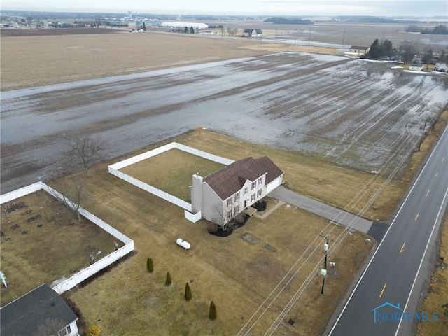 birds eye view of property with a rural view