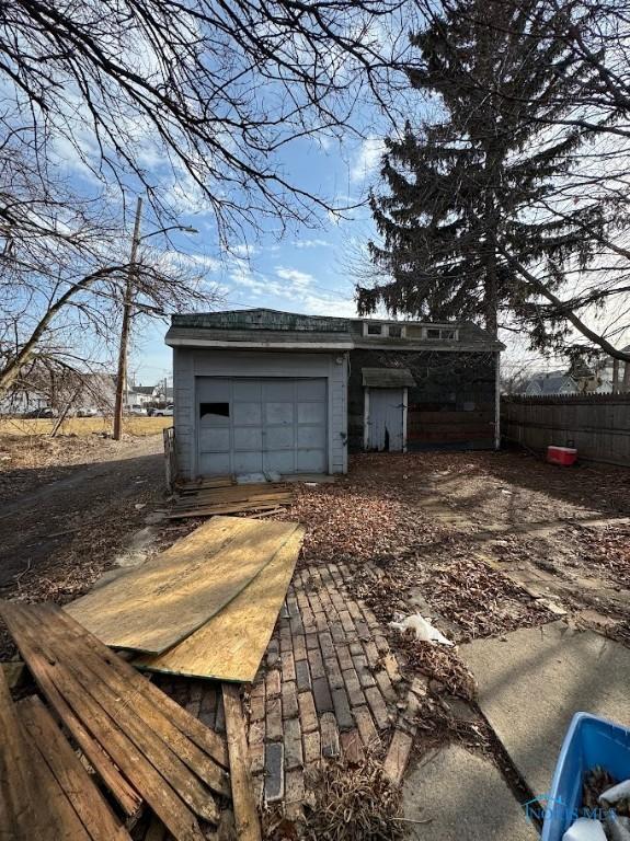 garage with fence